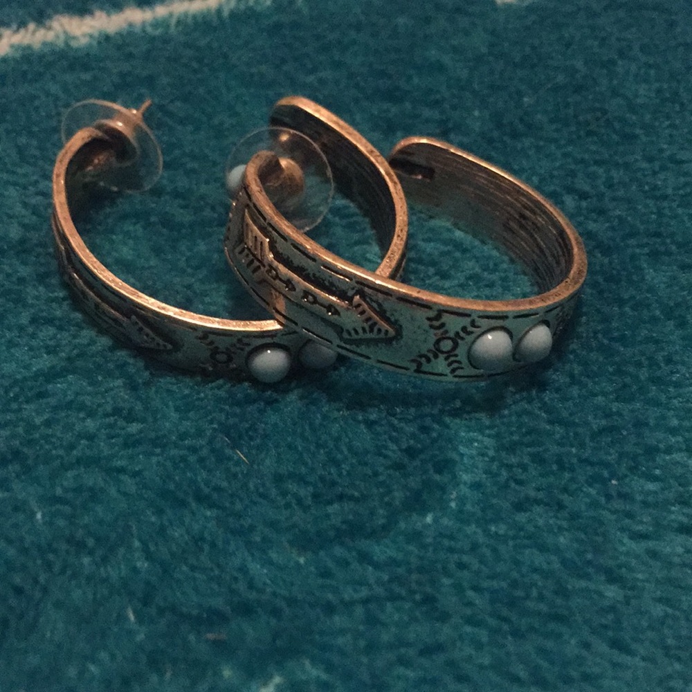 Silver arrow hoops with blue stones